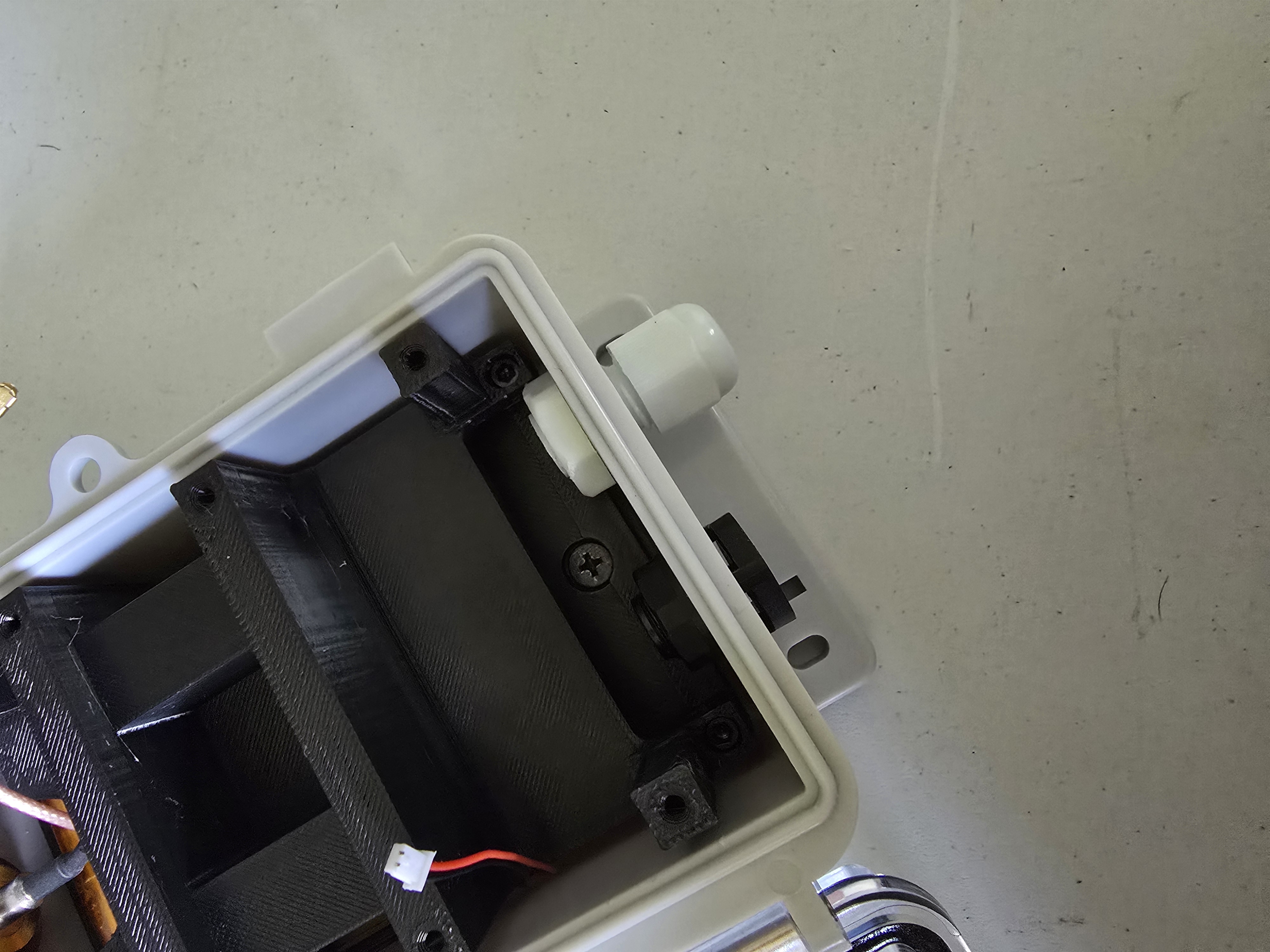 Cable gland and pressure relief valve installed in bottom holes